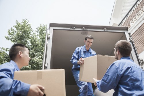 Furniture removals team handling a sofa move in Kingston upon Thames