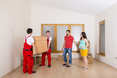 Professional movers loading household items in Kingston upon Thames