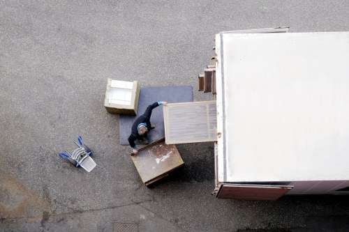 Retail stock and shelving being moved during a Kingston upon Thames commercial relocation
