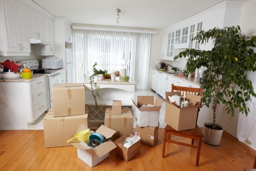 Moving team preparing boxes and equipment with safety focus