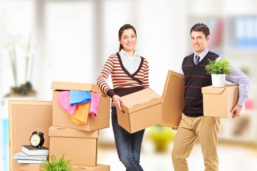 Packed boxes and furniture ready for loading during a Kingston move