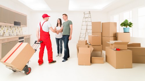 Movers handling furniture carefully in a Kingston upon Thames property