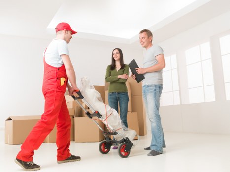 Local team planning a grand piano move with protective equipment in Kingston upon Thames