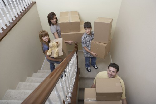 Packed office crates and furniture prepared for a business move in Kingston